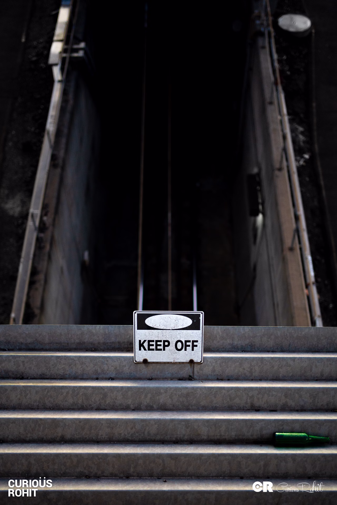 A sign on a stairway warning people to keep off