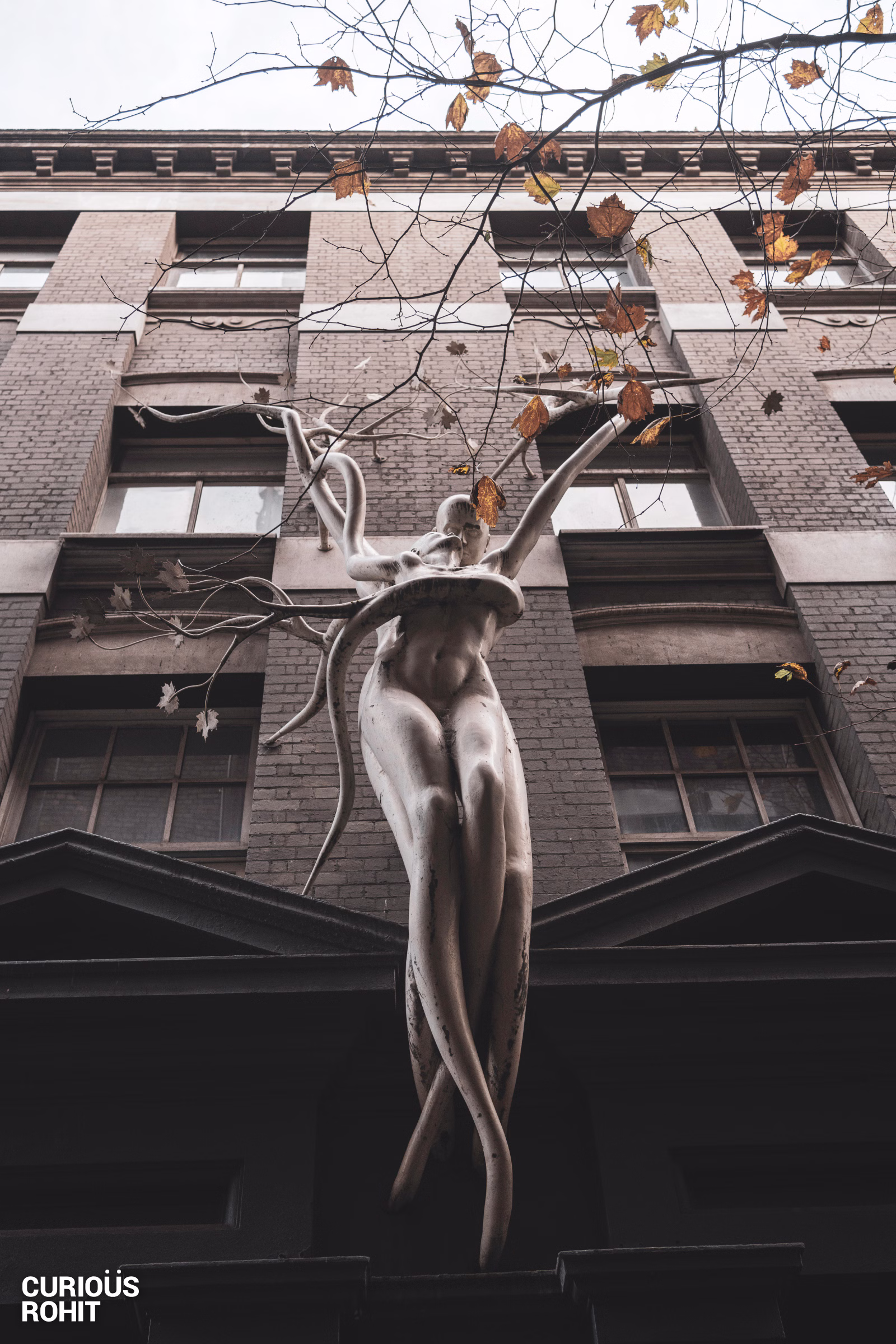 A statue of a woman holding a branch