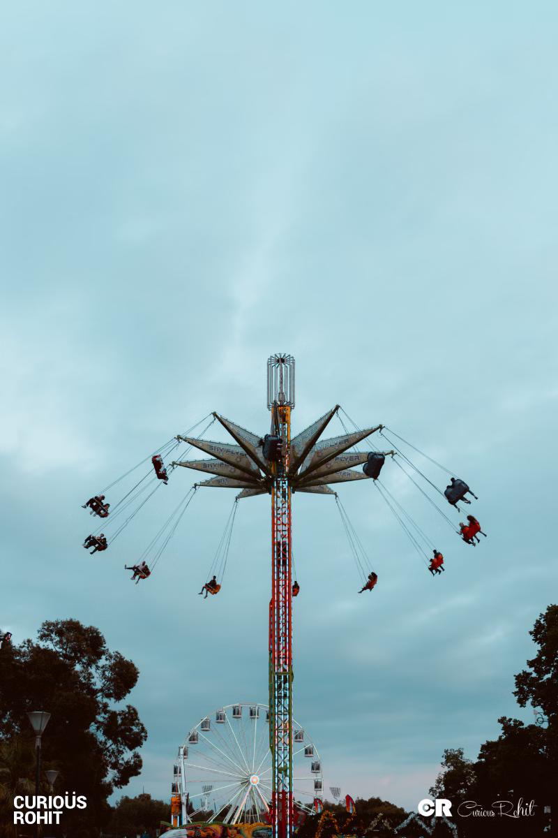 A large ferris wheel with many people riding it