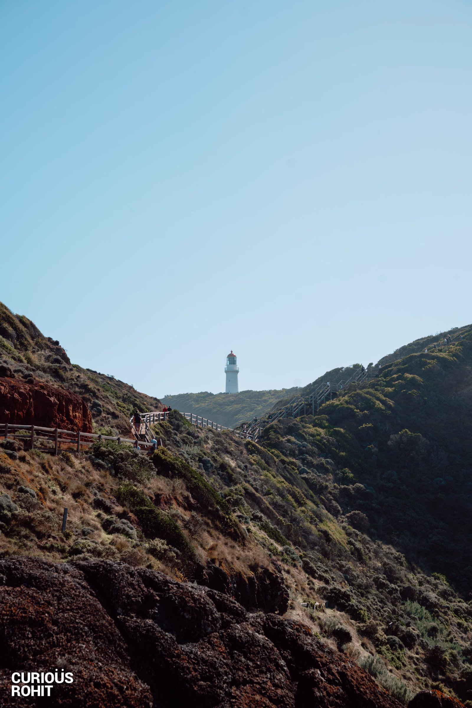 A lighthouse on a hill