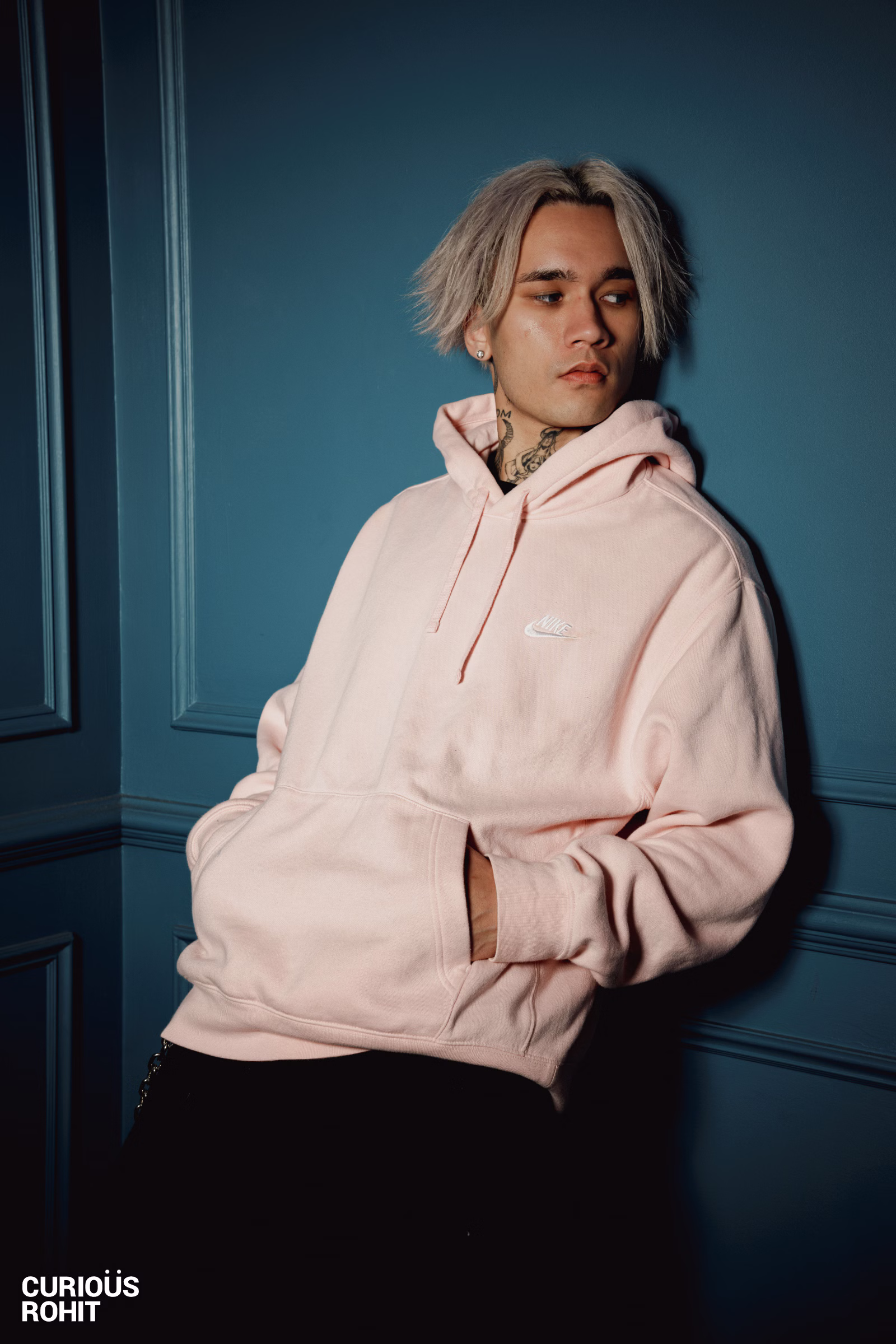 A man wearing a pink hoodie
